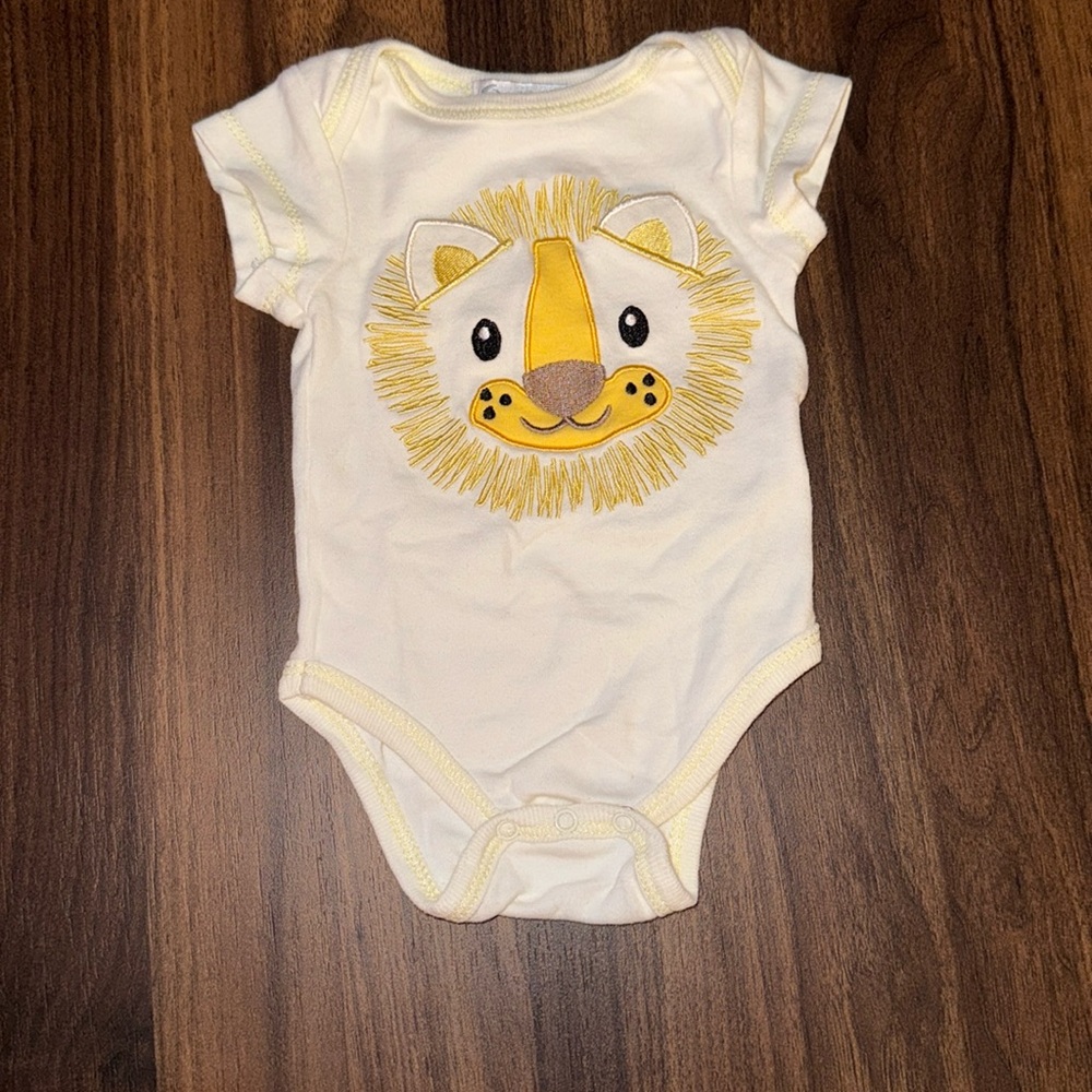 Embroidered lion onesie